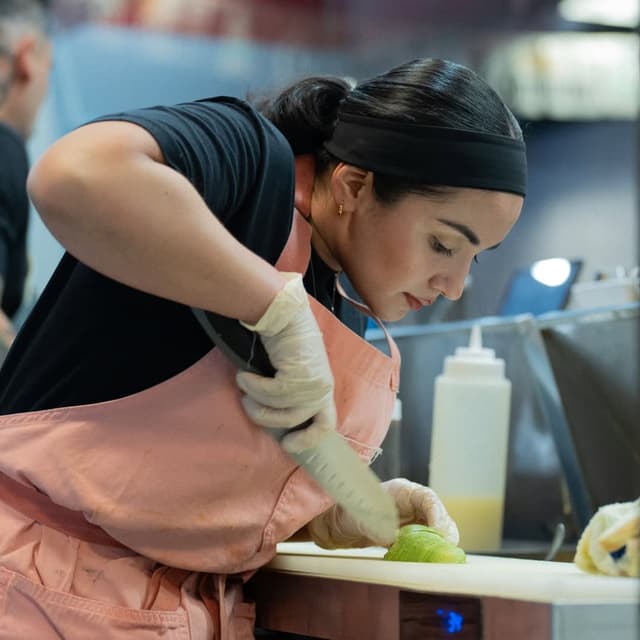 Hands preparing fresh shrimp ceviche with authentic techniques