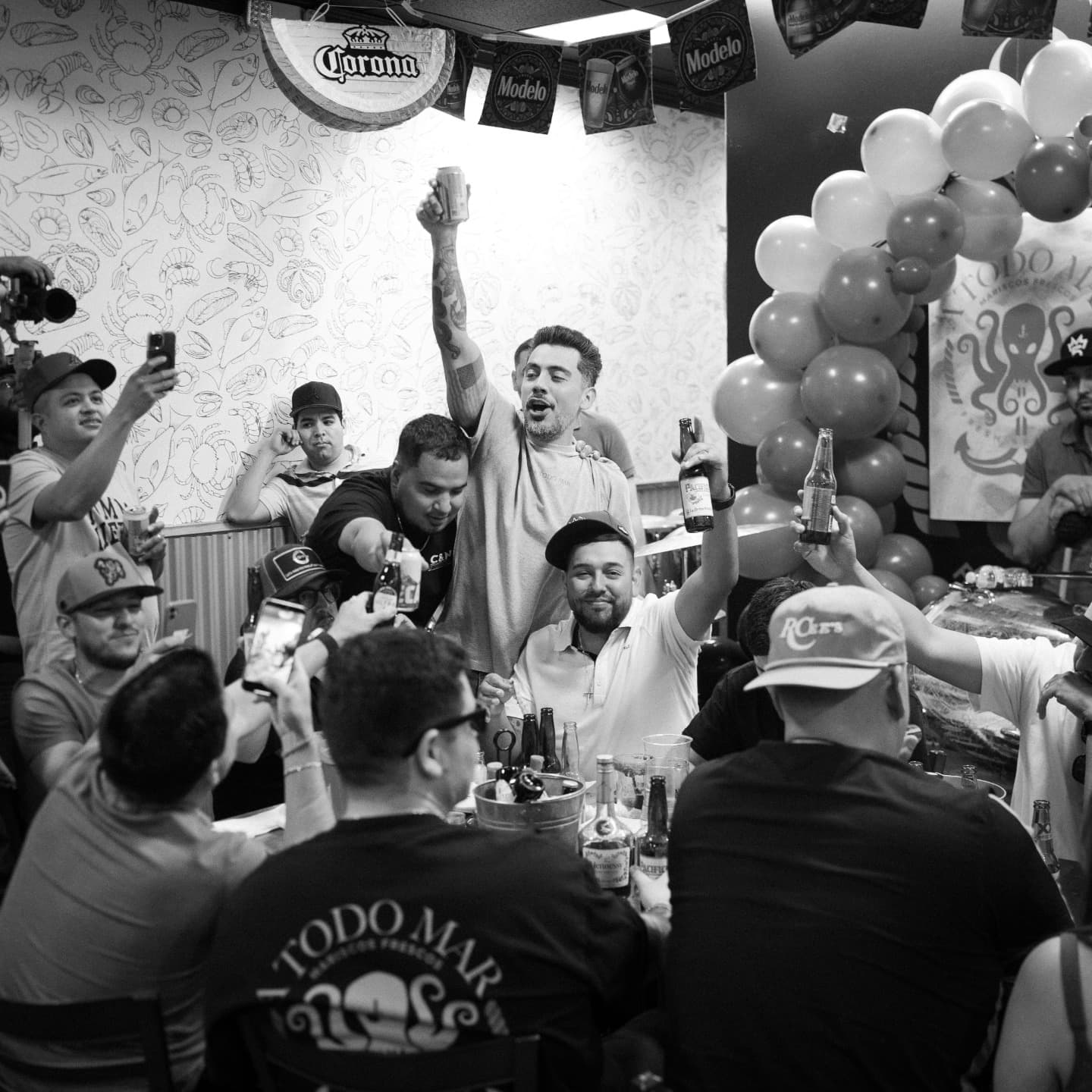 Cozy interior of Mariscos a Todo Mar restaurant with families dining